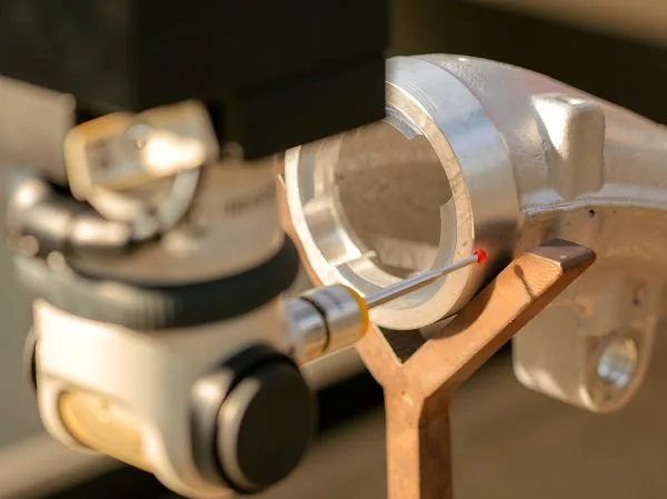 CMM probe measuring exhaust manifold precision dimensions